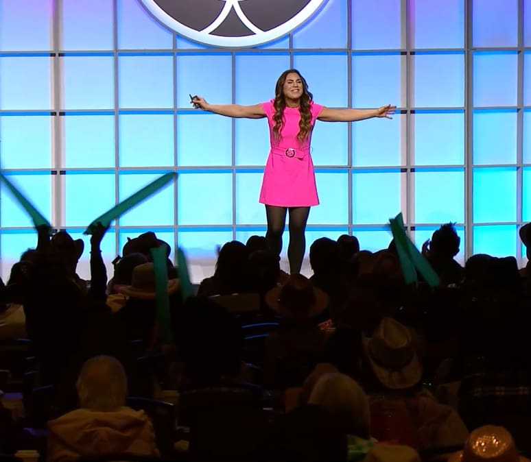 Erin King Motivational Speaker snapshot on stage at a motivational event.