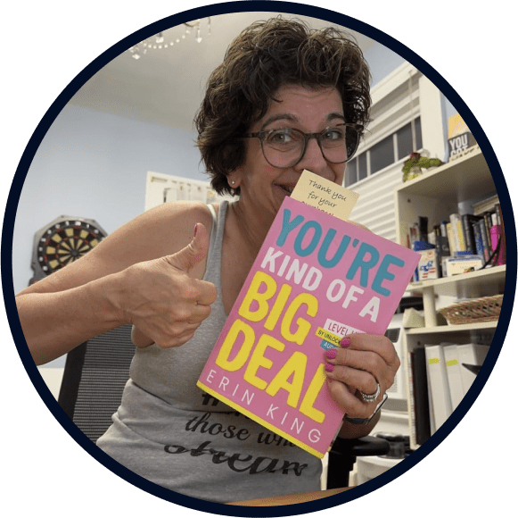 Image of Maria Peterson holding the book 'You're Kind of a Big Deal,' smiling with a thumbs up gesture. She provided a review praising Erin King's insights and the impact from her presentation at the BODi Summit 2023, emphasizing the book's reminder of valuable empowerment.