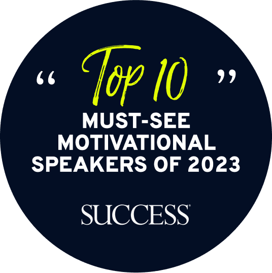 Badge labeled 'Top 10 Must-See Motivational Speakers of 2023' by Success Magazine, recognizing Erin King among the esteemed motivational speakers acknowledged for their impact and influence.